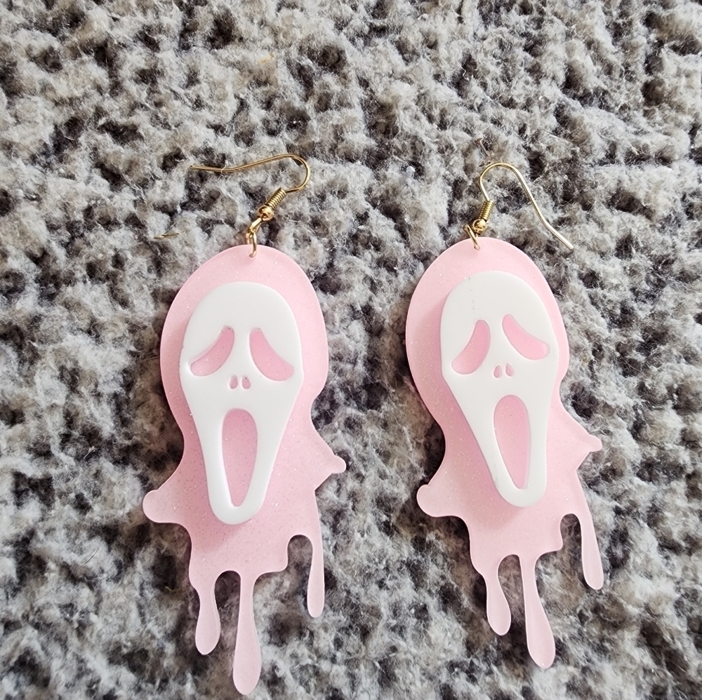 Pink glittered acrylic ghost face dangle earrings